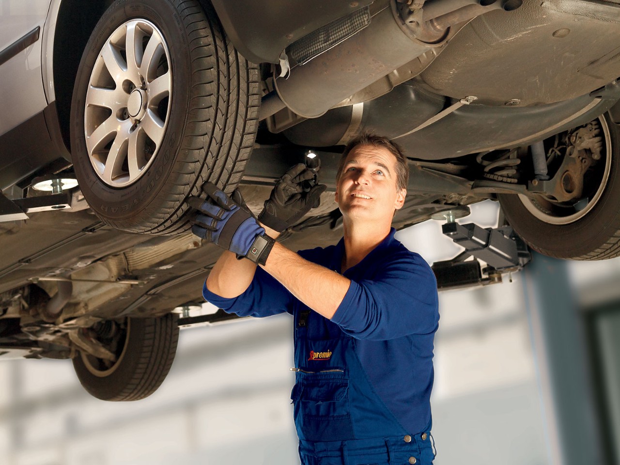 Mechanic working on tyres with TPMS